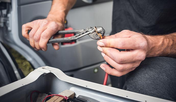 technician repairing RV wiring