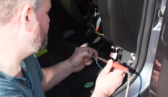 technician repairing electrical wiring in a RV