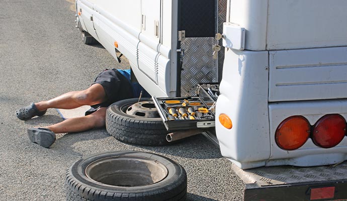 a mechanic repairing an rv