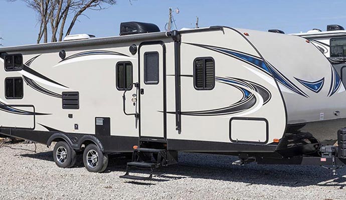 a newly serviced RV parked in a driveway