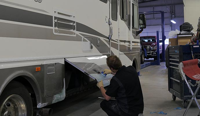 A person working on RV maintanance in a workshop