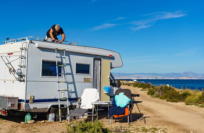 a man repairs an RV