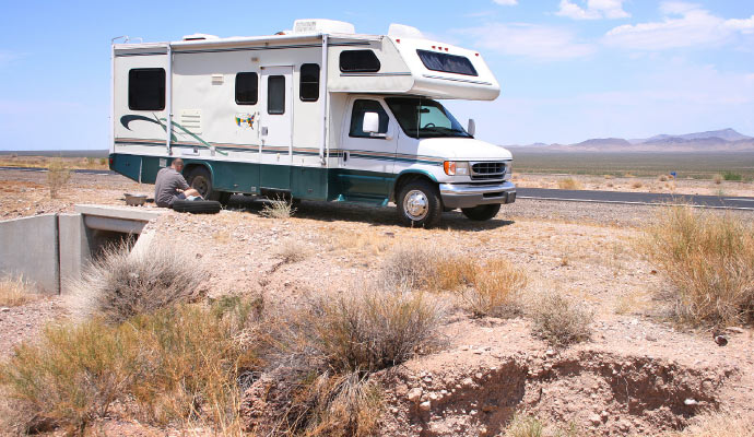 A person changing an RV tire